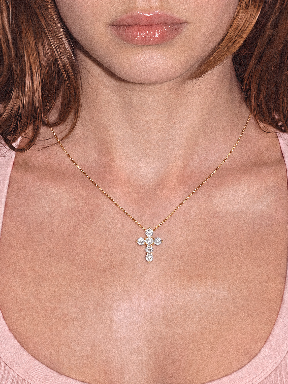 Model wearing the Bow Tie Lab Diamonds 1.55 ctw 7-stone cross pendant necklace — round white lab-grown diamonds on a delicate gold chain at the neckline.