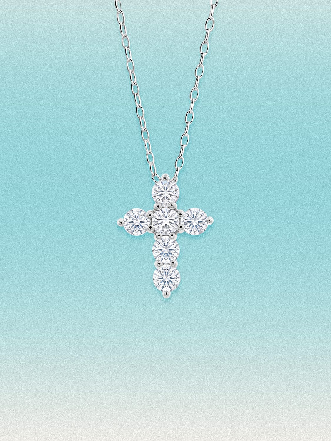 Bow Tie Lab Diamonds 1.55 ctw 7-stone cross pendant necklace — seven round white lab-grown diamonds set in a cross, shown in 14K white gold on a delicate chain.