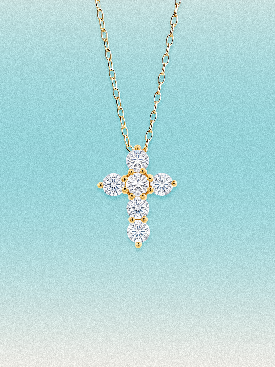 Bow Tie Lab Diamonds 1.55 ctw 7-stone cross pendant necklace — seven round white lab-grown diamonds set in a cross, shown in 14K yellow gold on a delicate chain.