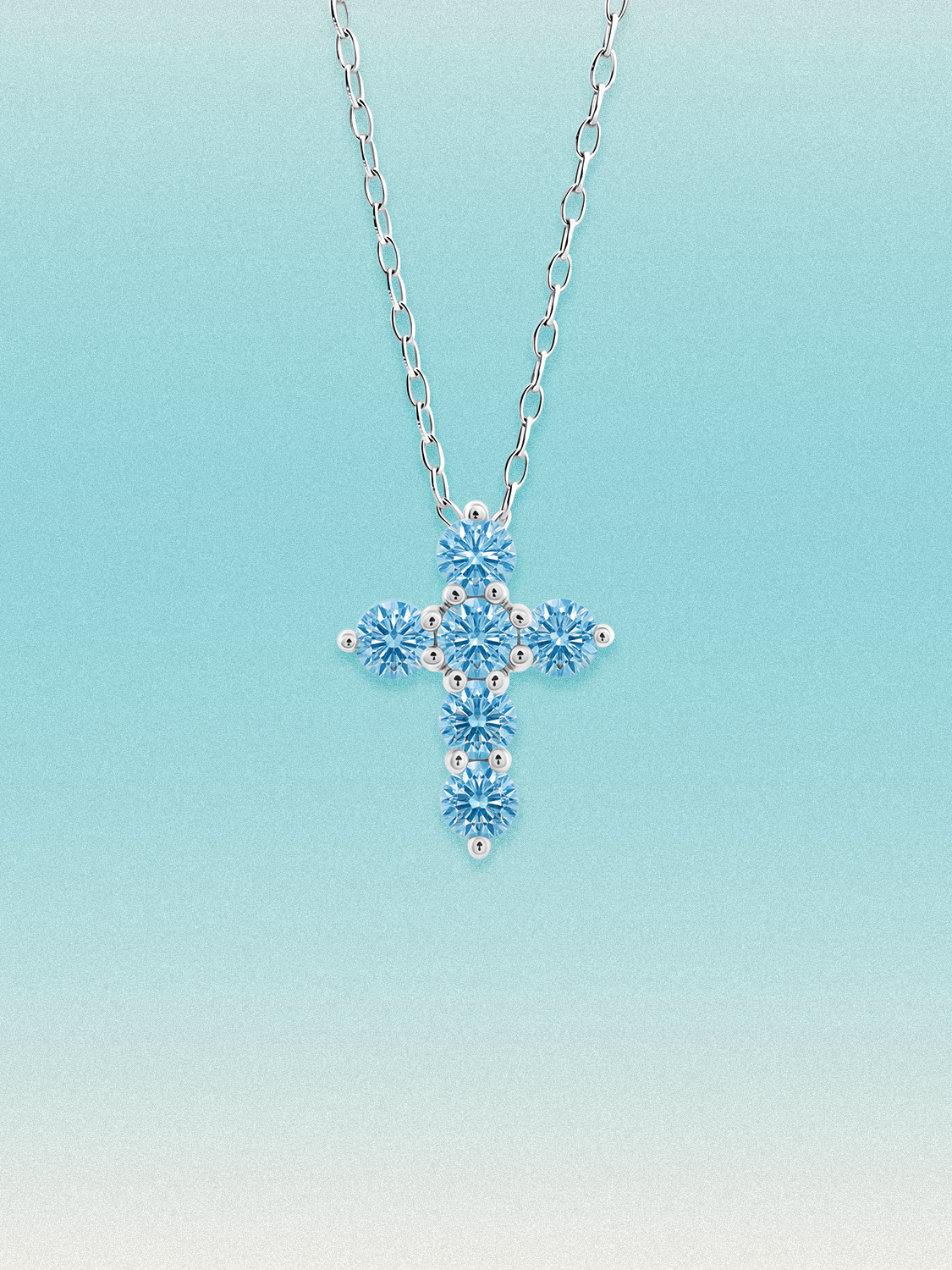 Bow Tie Lab Diamonds 1.55 ctw 7-stone Fancy Blue cross pendant necklace — round blue lab-grown diamonds set in a cross, shown in 14K white gold on a delicate chain.