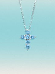 Bow Tie Lab Diamonds 1.55 ctw 7-stone Fancy Blue cross pendant necklace — round blue lab-grown diamonds set in a cross, shown in 14K white gold on a delicate chain.