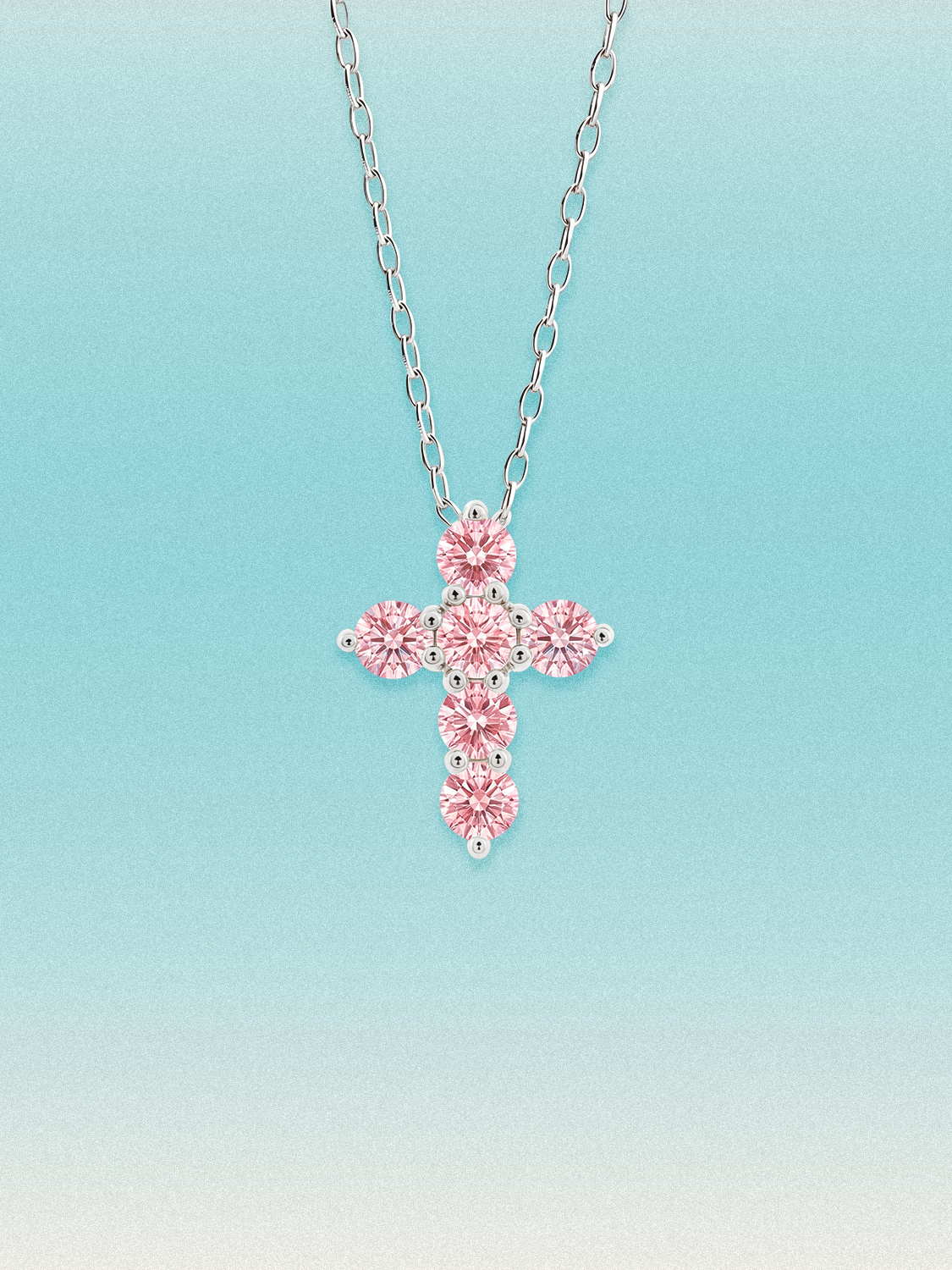 Bow Tie Lab Diamonds 1.55 ctw 7-stone Fancy Pink cross pendant necklace — round pink lab-grown diamonds set in a cross, shown in 14K white gold on a delicate chain.
