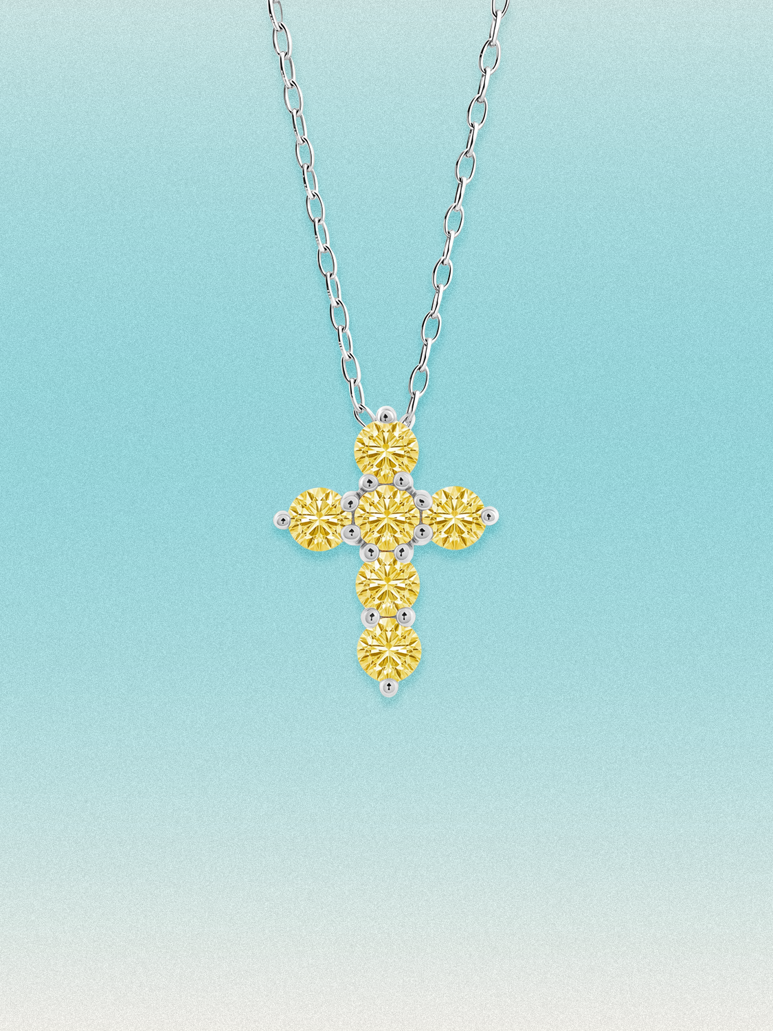 Bow Tie Lab Diamonds 1.55 ctw 7-stone Fancy Yellow cross pendant necklace — round yellow lab-grown diamonds set in a cross, shown in 14K white gold on a delicate chain.