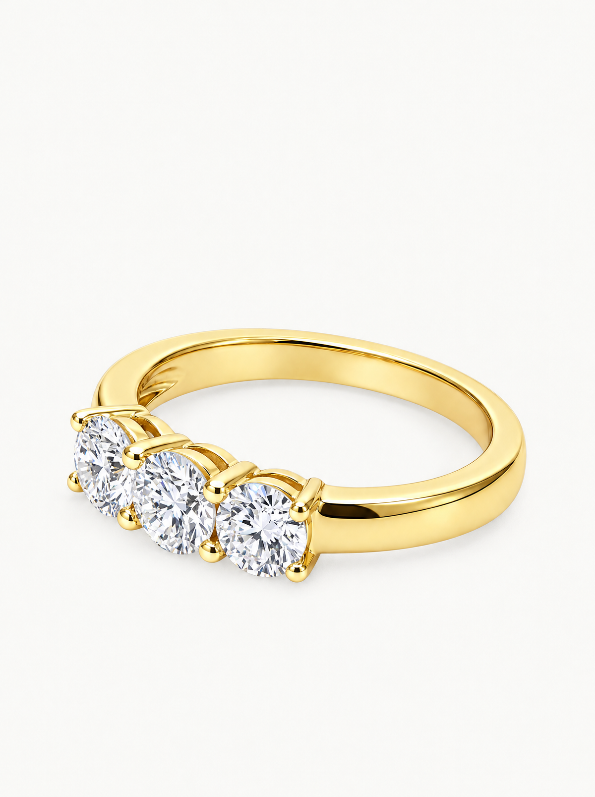 1.65 ctw Round Three-Stone Lab-Grown Diamond Engagement Ring in 14K yellow gold, angled side view — Bow Tie Lab Diamonds