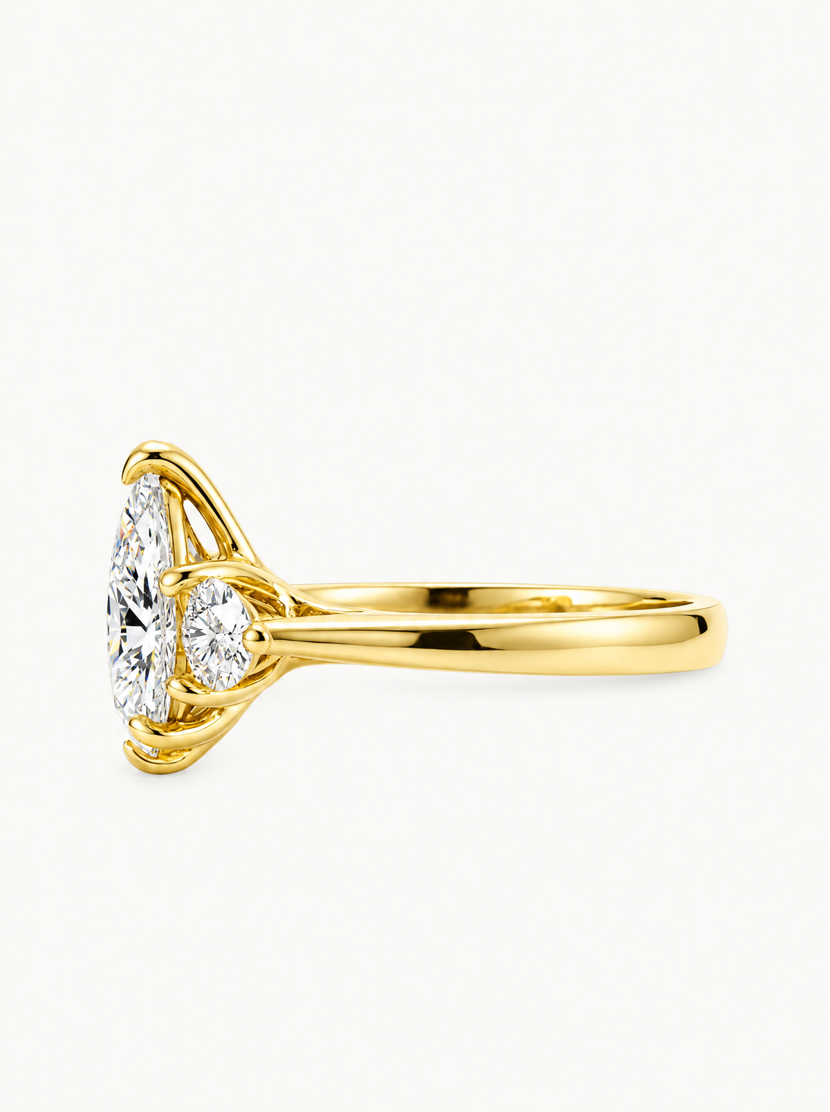 2.50 ctw Pear Three-Stone Lab-Grown Diamond Engagement Ring in 14K yellow gold, angled side view — Bow Tie Lab Diamonds