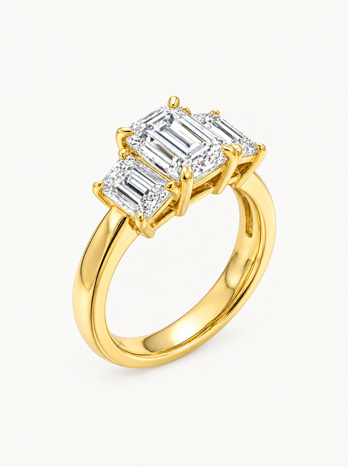 3.00 ctw Emerald Three-Stone Lab-Grown Diamond Engagement Ring in 14K yellow gold, angled side view — Bow Tie Lab Diamonds
