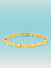 Bow Tie Lab Diamonds Fancy Yellow 4.3mm (12.00 ctw) Round 4-Prong lab-grown diamond tennis bracelet — 39 round yellow lab-grown diamonds, 12.00 ctw total, 7-inch, shown in 14K yellow gold.