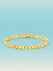 Bow Tie Lab Diamonds Fancy Yellow 4.6mm (13.00 ctw) Round 4-Prong lab-grown diamond tennis bracelet — 37 round yellow lab-grown diamonds, 13.00 ctw total, 7-inch, shown in 14K yellow gold.