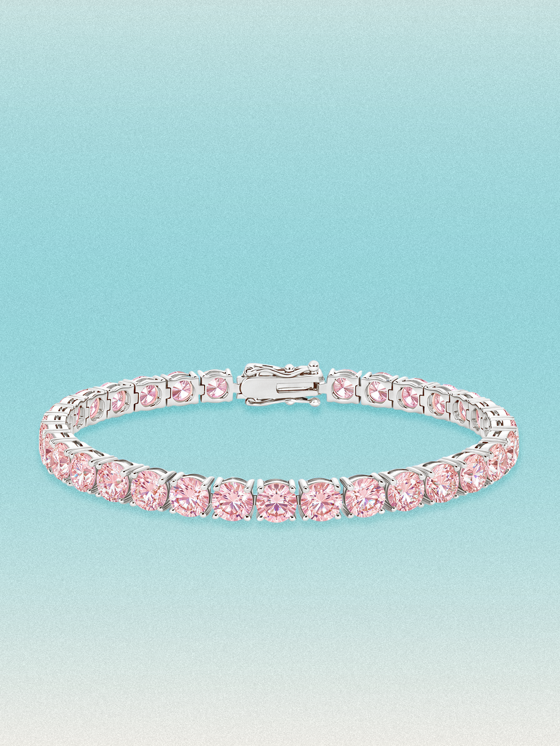 Bow Tie Lab Diamonds Fancy Pink 5.2mm (17.00 ctw) Round 4-Prong lab-grown diamond tennis bracelet — 32 round pink lab-grown diamonds, 17.00 ctw total, 7-inch, shown in 14K white gold.