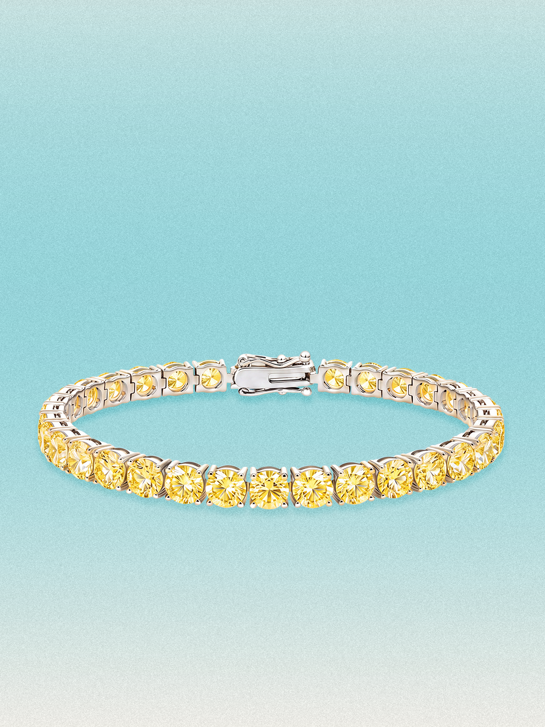 Bow Tie Lab Diamonds Fancy Yellow 5.2mm (17.00 ctw) Round 4-Prong lab-grown diamond tennis bracelet — 32 round yellow lab-grown diamonds, 17.00 ctw total, 7-inch, shown in 14K white gold.