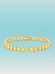 Bow Tie Lab Diamonds Fancy Yellow 5.2mm (17.00 ctw) Round 4-Prong lab-grown diamond tennis bracelet — 32 round yellow lab-grown diamonds, 17.00 ctw total, 7-inch, shown in 14K yellow gold.