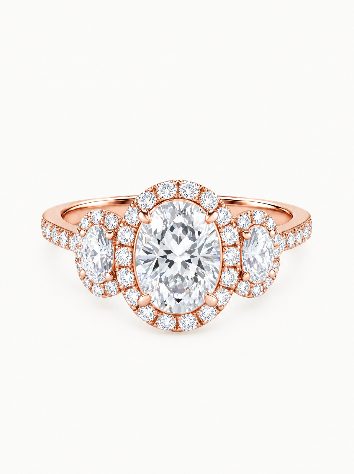 7.00 ctw Oval Three-Stone Halo Pave Lab-Grown Diamond Engagement Ring in 14K rose gold, front view — Bow Tie Lab Diamonds