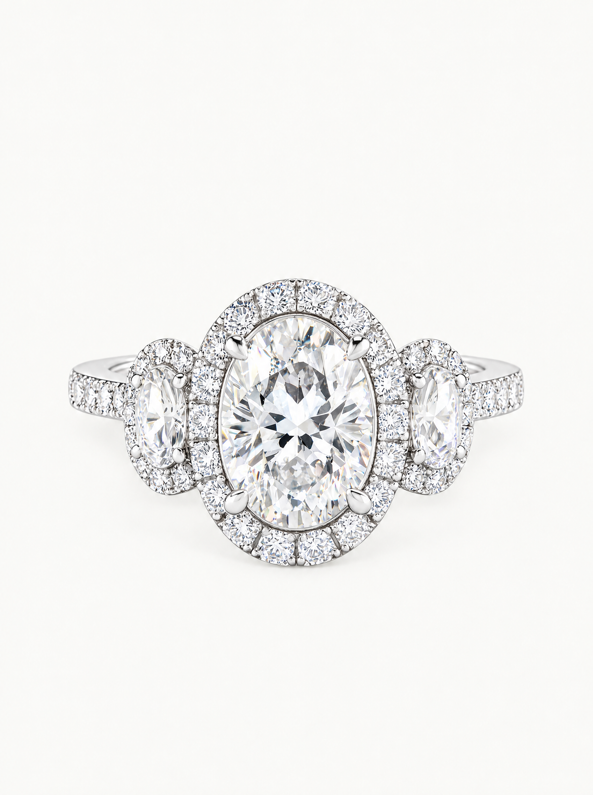 7.00 ctw Oval Three-Stone Halo Pave Lab-Grown Diamond Engagement Ring in 14K white gold, front view — Bow Tie Lab Diamonds