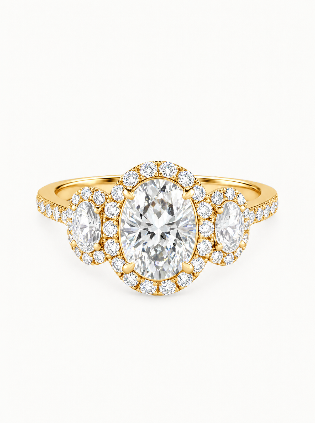 7.00 ctw Oval Three-Stone Halo Pave Lab-Grown Diamond Engagement Ring in 14K yellow gold, front view — Bow Tie Lab Diamonds