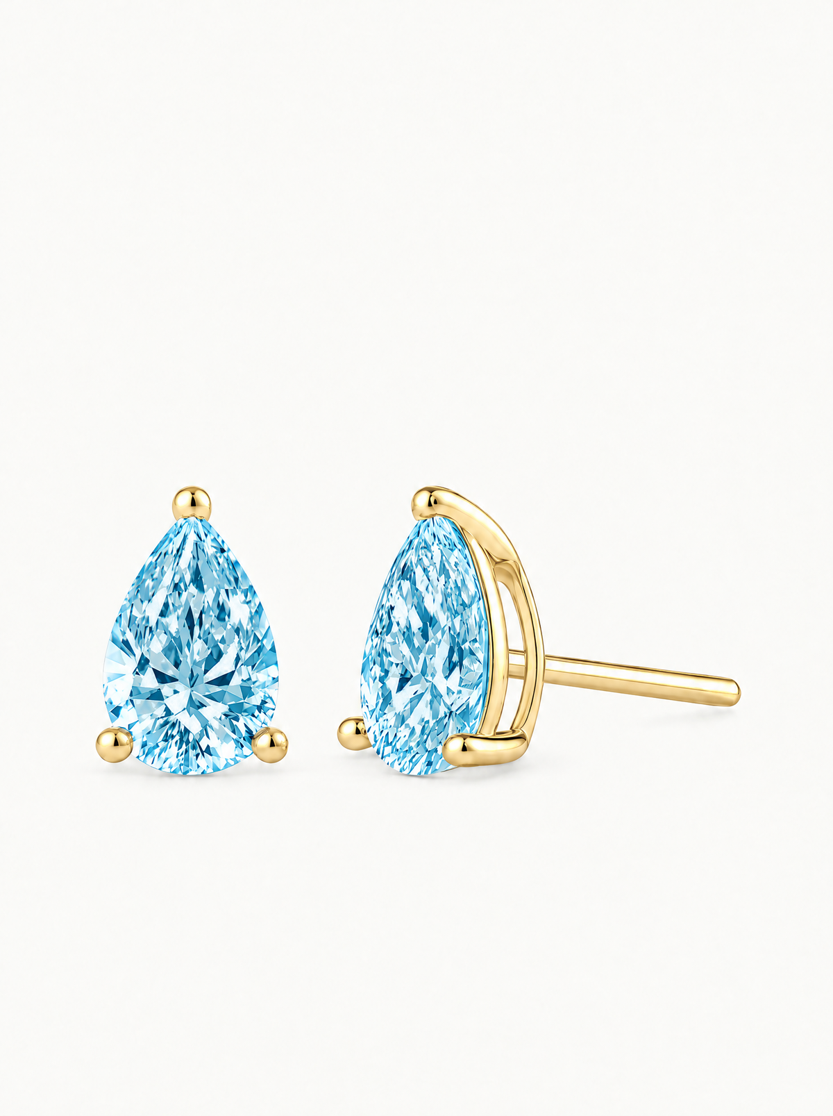 Fancy Blue Pear Cut Lab-Grown Diamond Stud Earrings in 14K yellow gold, side view — Bow Tie Lab Diamonds