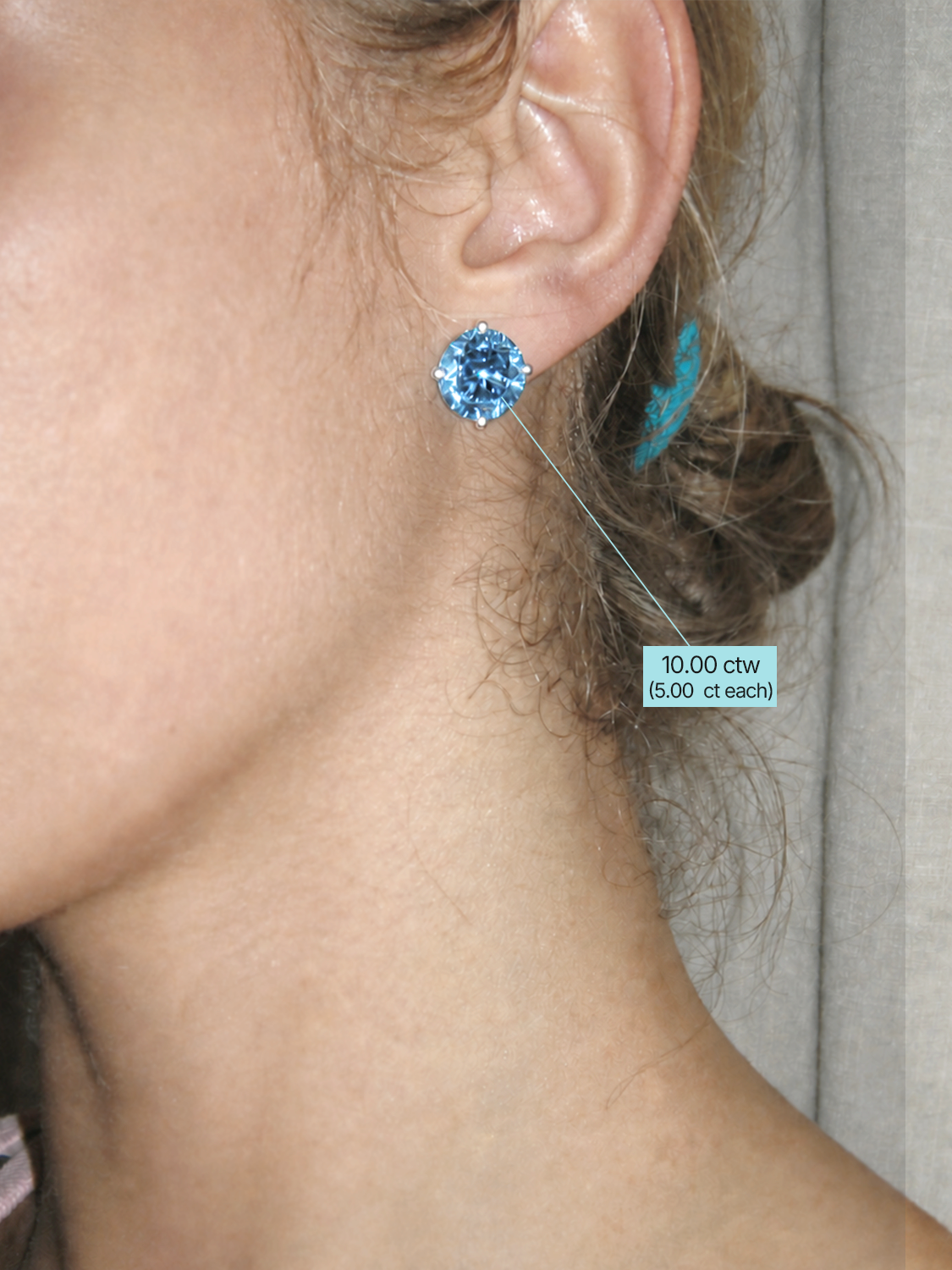 Fancy Blue Round Cut Lab-Grown Diamond Stud Earrings, worn on the ear — Bow Tie Lab Diamonds