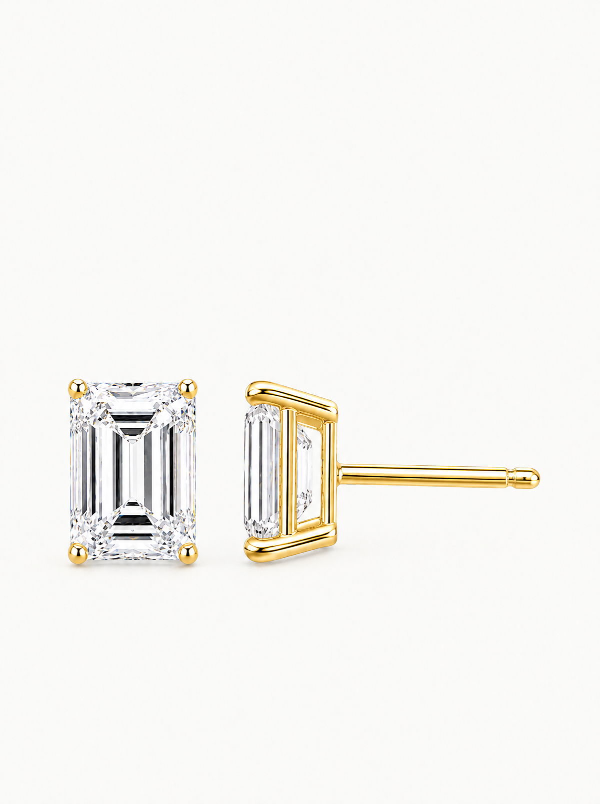 Emerald Cut Lab-Grown Diamond Stud Earrings in 14K yellow gold, angled side view — Bow Tie Lab Diamonds