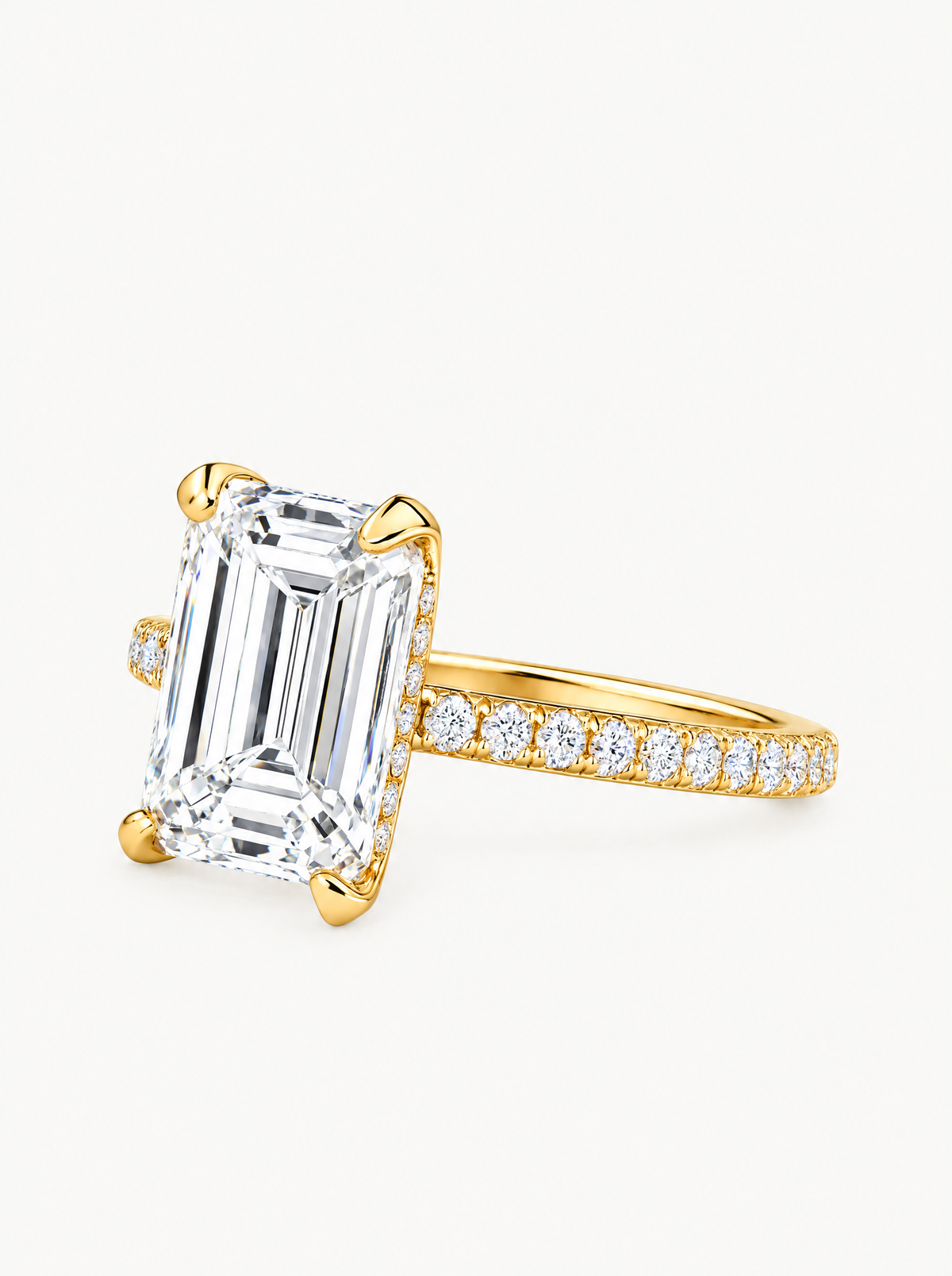 Emerald Cut Solitaire Hidden Halo Lab-Grown Diamond Engagement Ring in 14K yellow gold, angled side view — Bow Tie Lab Diamonds