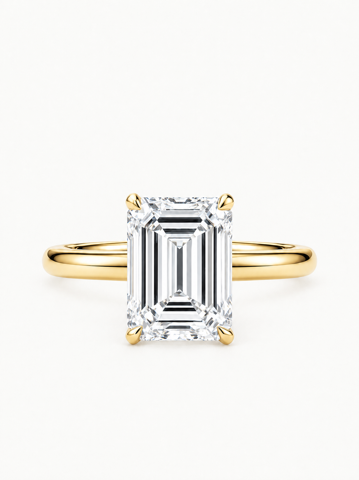 Emerald Cut Solitaire Lab-Grown Diamond Engagement Ring in 14K yellow gold, angled side view — Bow Tie Lab Diamonds