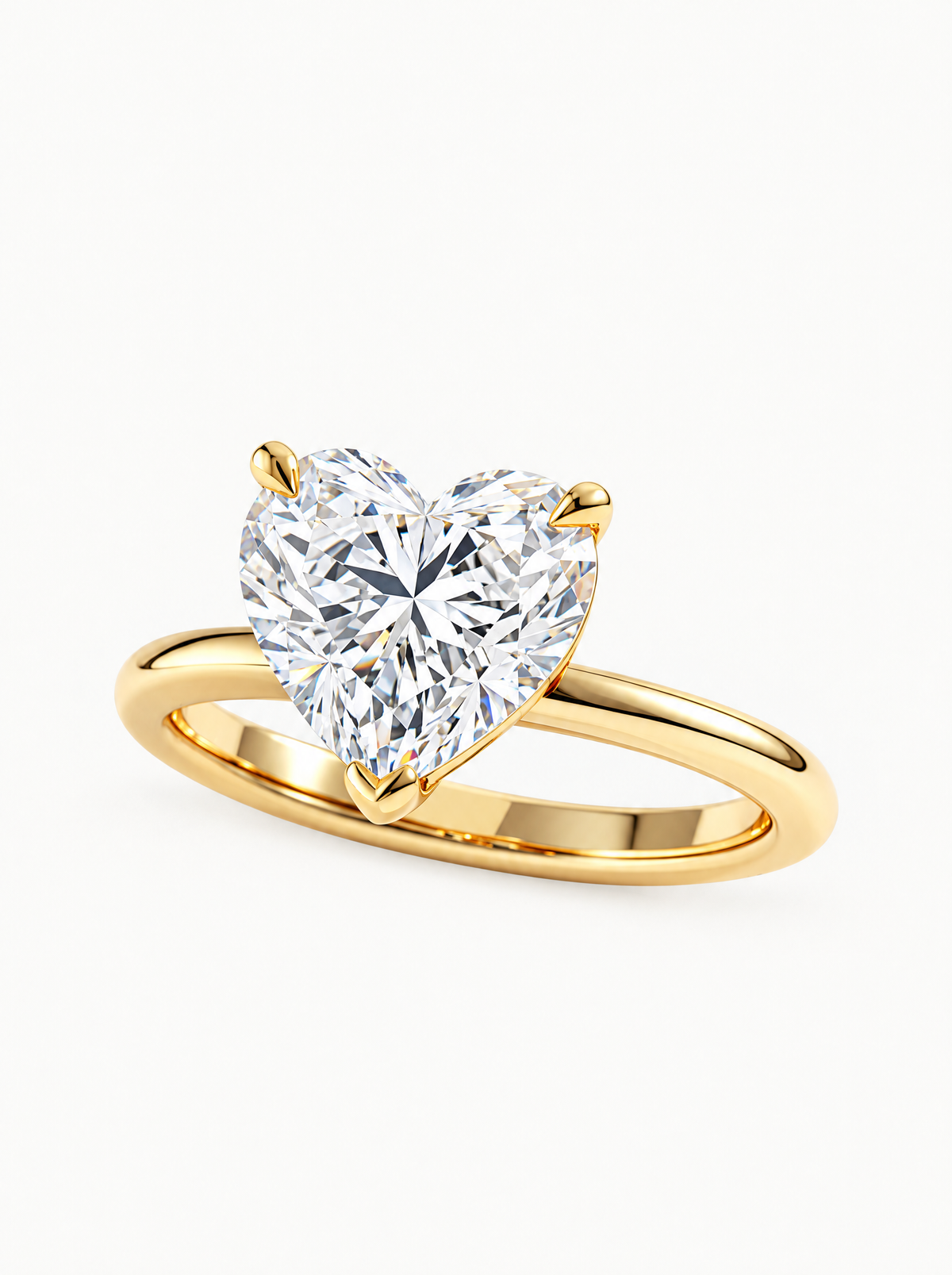 Heart Cut Solitaire Lab-Grown Diamond Engagement Ring in 14K yellow gold, angled side view — Bow Tie Lab Diamonds
