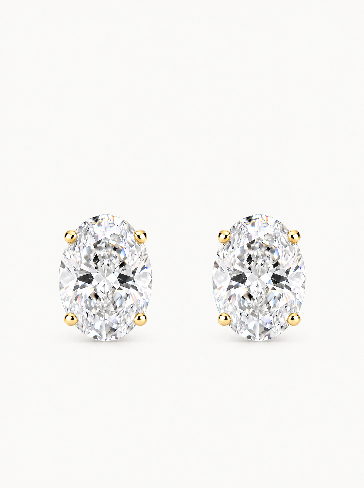 Oval Cut Lab-Grown Diamond Stud Earrings in 14K yellow gold, front view — Bow Tie Lab Diamonds