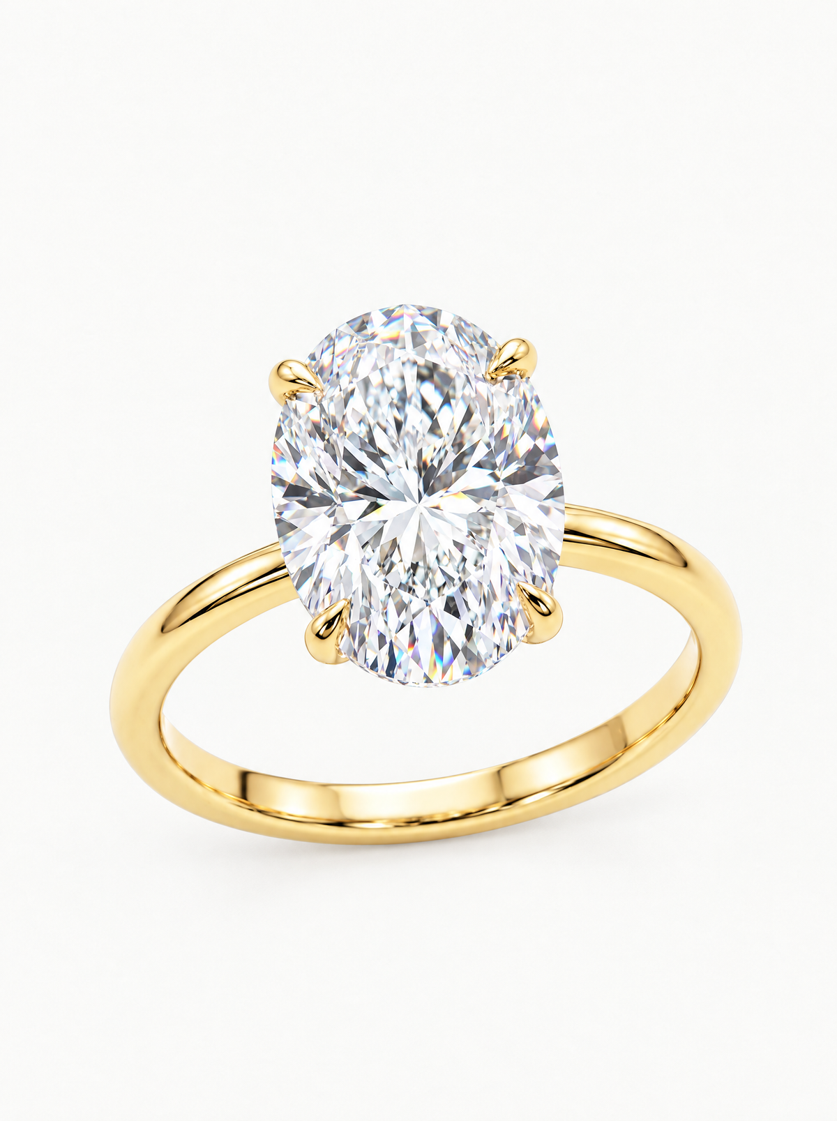 Oval Cut Solitaire Lab-Grown Diamond Engagement Ring in 14K yellow gold, angled side view — Bow Tie Lab Diamonds