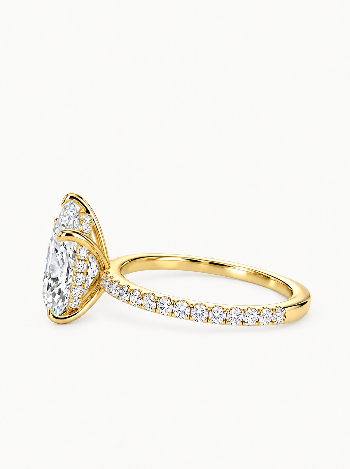 Pear Cut Solitaire Hidden Halo Lab-Grown Diamond Engagement Ring in 14K yellow gold, angled side view — Bow Tie Lab Diamonds