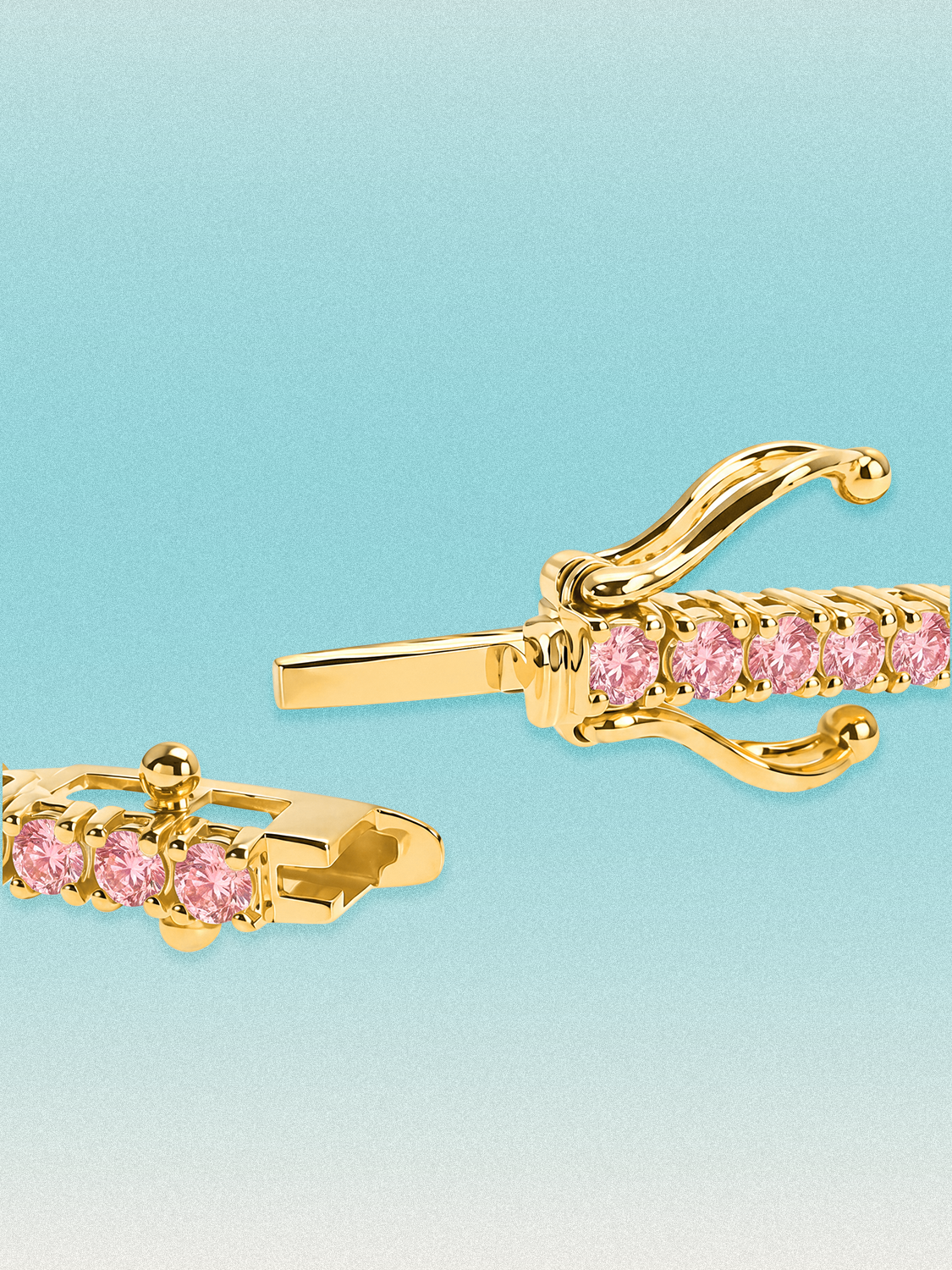 Clasp detail of a Bow Tie Lab Diamonds Fancy Pink Round 4-Prong 7-inch lab-grown diamond tennis bracelet in 14K yellow gold.