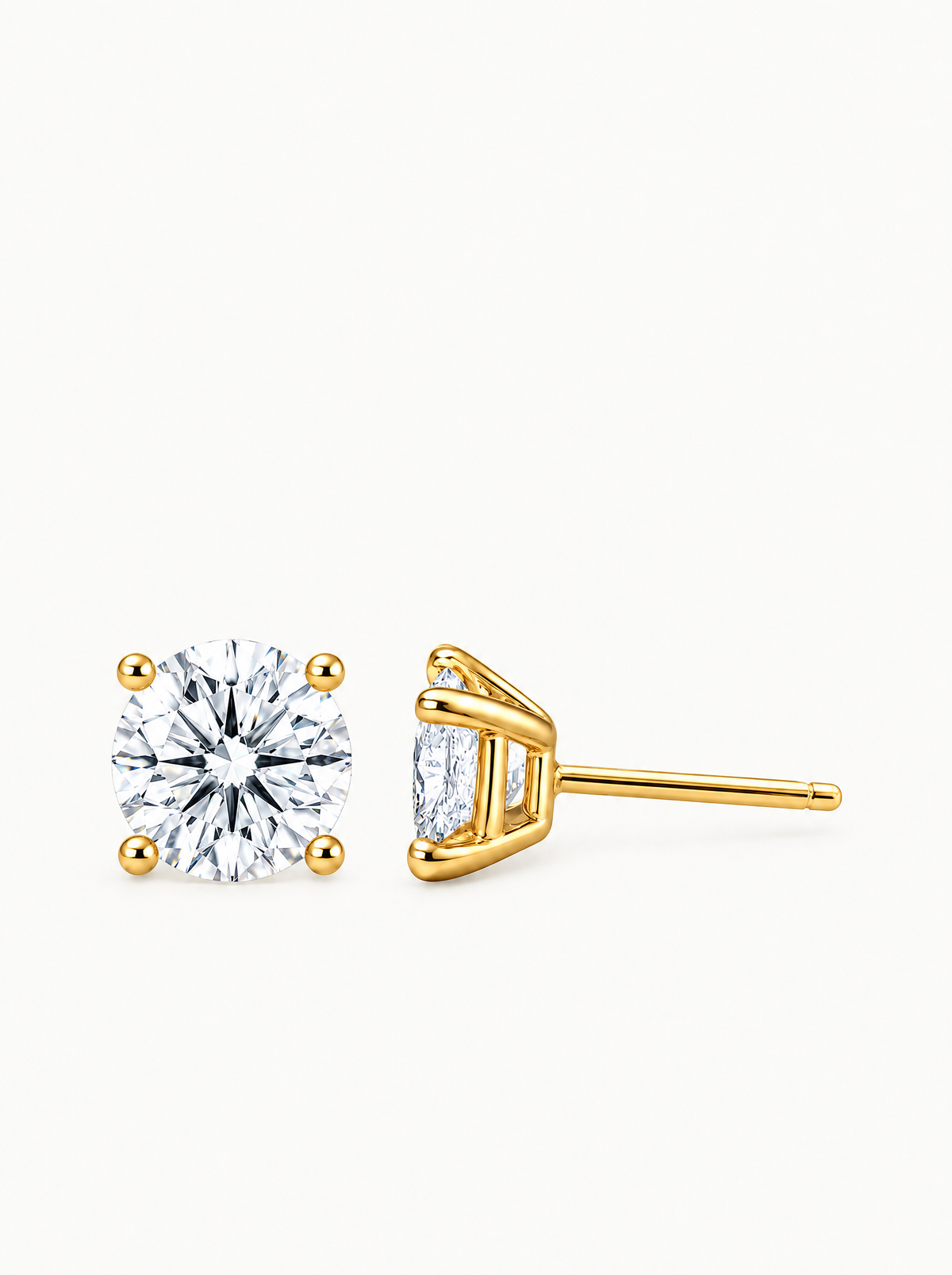 Round Cut 4-Prong Lab-Grown Diamond Stud Earrings in 14K yellow gold, angled side view — Bow Tie Lab Diamonds