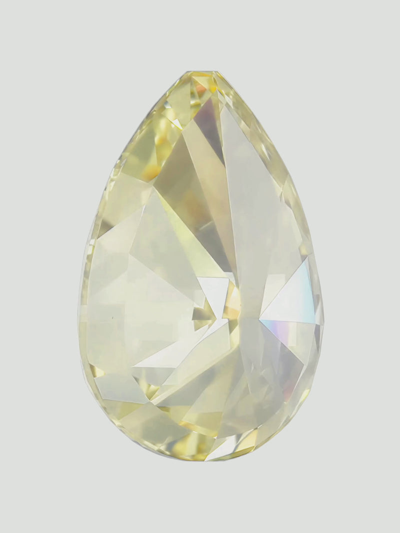 Rotating video of a fancy yellow pear cut lab-grown diamond showing its sparkle — Bow Tie Lab Diamonds