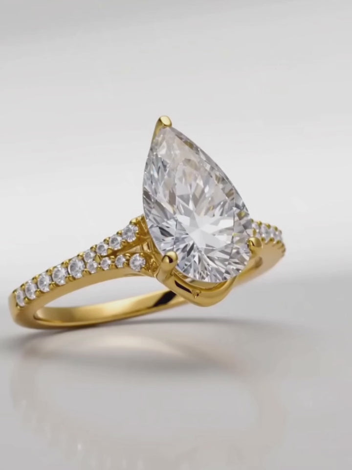 Load video: Video of the 4.50 ctw Pear Hidden Halo Split Shank Pave Lab-Grown Diamond Engagement Ring, showing sparkle and movement — Bow Tie Lab Diamonds