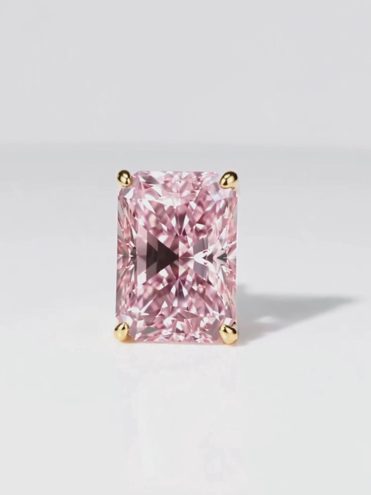 Load video: Video of the Fancy Pink Radiant Cut Lab-Grown Diamond Stud Earrings, showing sparkle and movement — Bow Tie Lab Diamonds