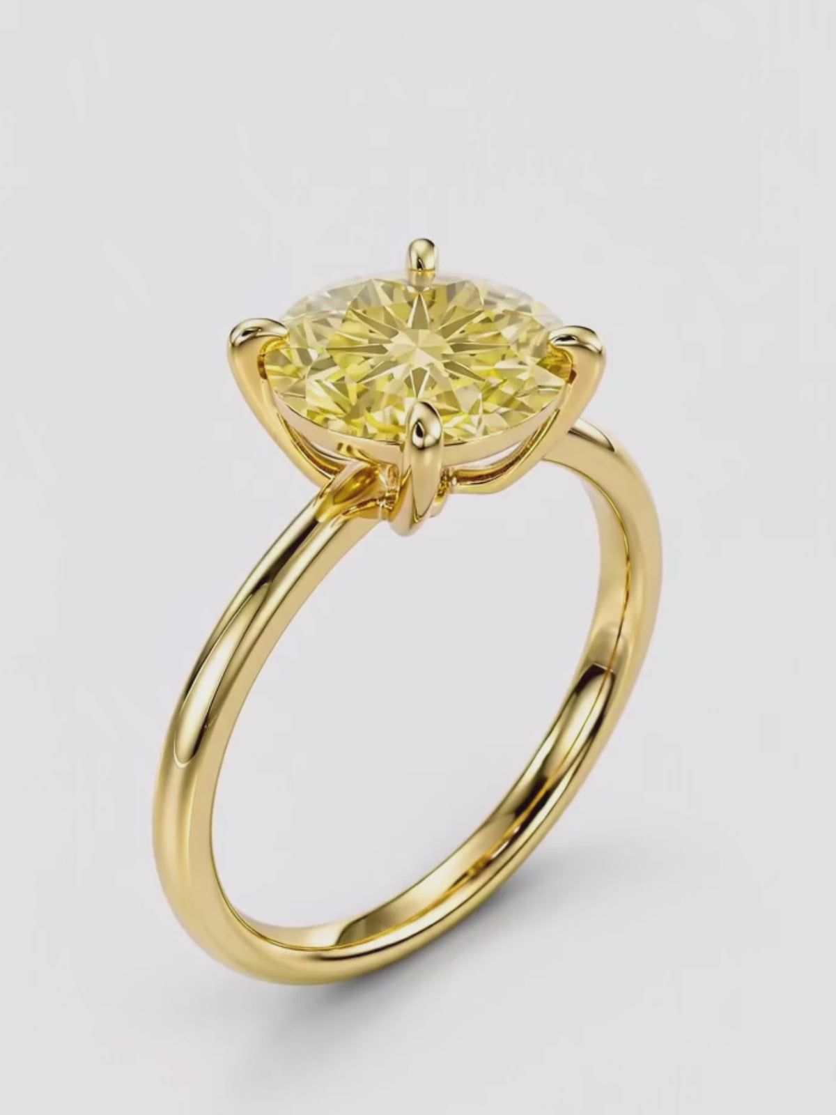 Load video: Video of the Fancy Yellow Round Cut 4-Prong Solitaire Lab-Grown Diamond Engagement Ring, showing sparkle and movement — Bow Tie Lab Diamonds