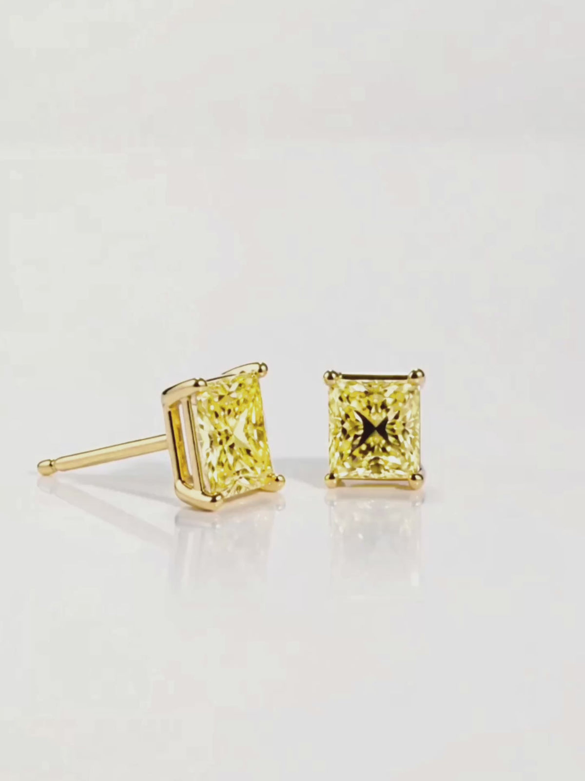 Load video: Video of the Fancy Yellow Princess Cut Lab-Grown Diamond Stud Earrings, showing sparkle and movement — Bow Tie Lab Diamonds
