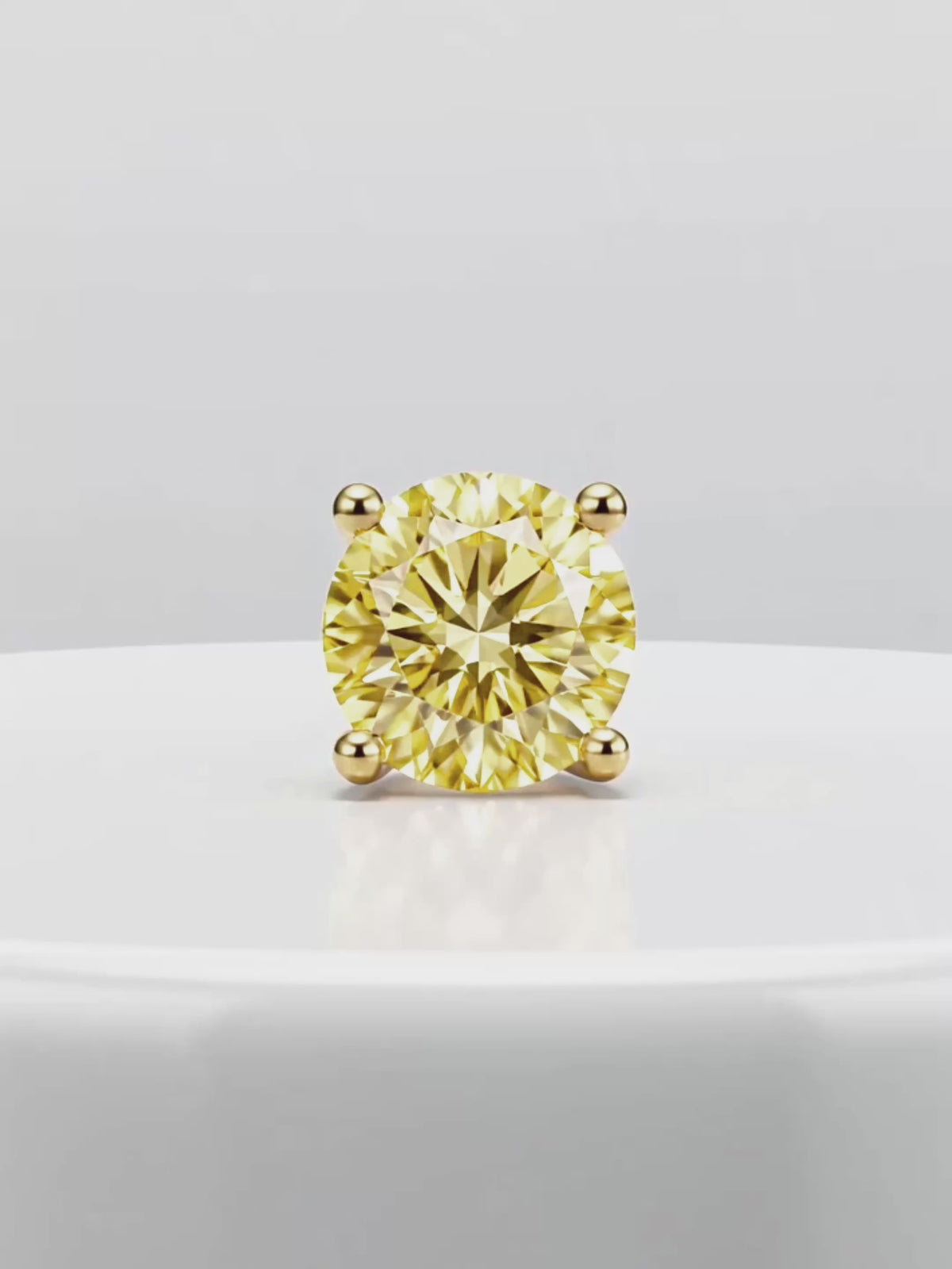 Load video: Video of the Fancy Yellow Round Cut Lab-Grown Diamond Stud Earrings, showing sparkle and movement — Bow Tie Lab Diamonds