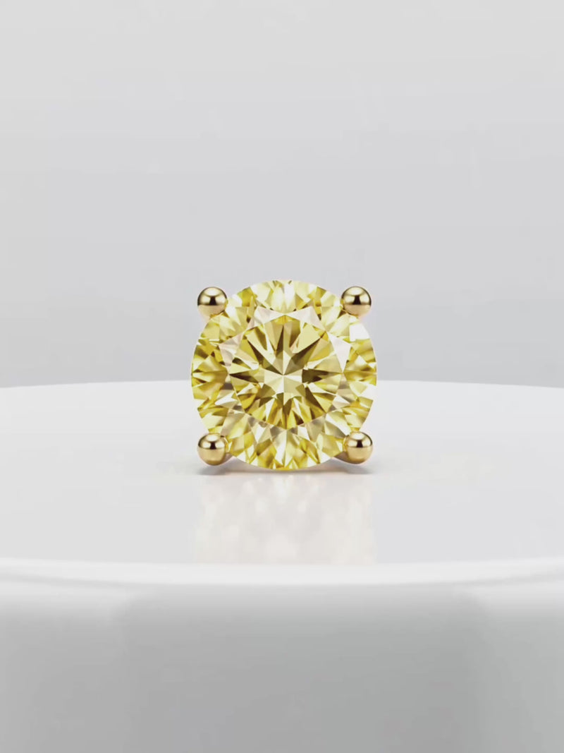 Video of the Fancy Yellow Round Cut Lab-Grown Diamond Stud Earrings, showing sparkle and movement — Bow Tie Lab Diamonds