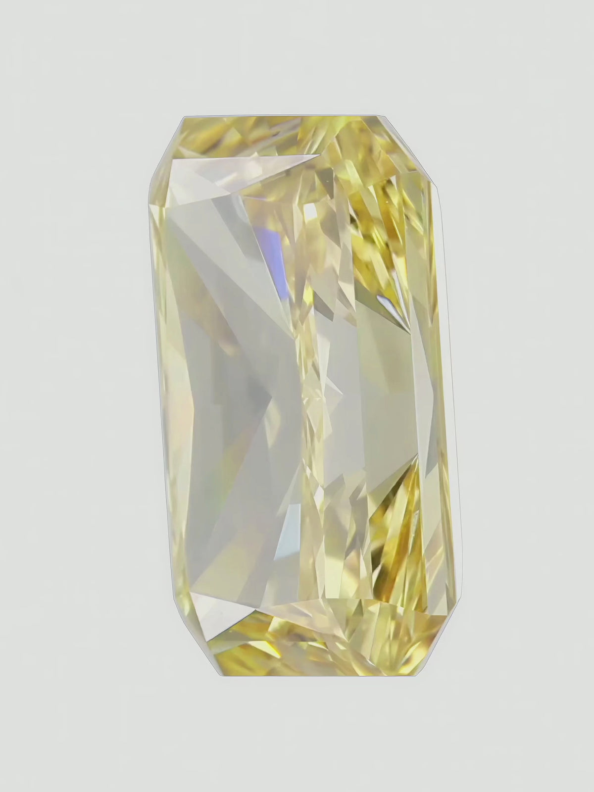 Load video: Rotating video of a fancy yellow radiant cut lab-grown diamond showing its sparkle — Bow Tie Lab Diamonds
