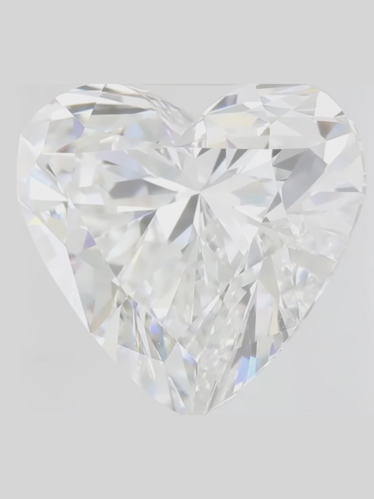 Load video: Rotating video of a colorless heart cut lab-grown diamond showing its sparkle — Bow Tie Lab Diamonds