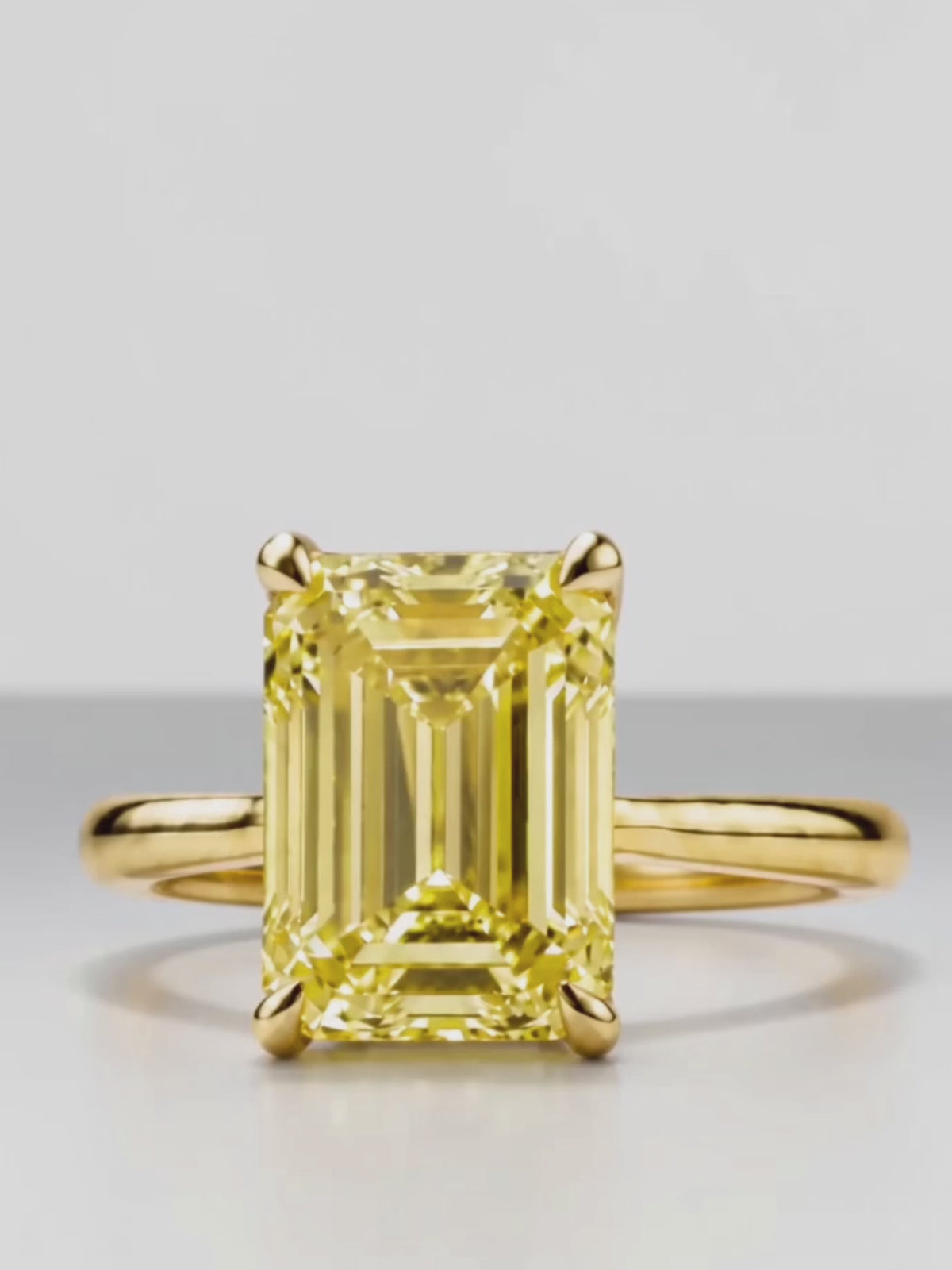 Load video: Video of the Fancy Yellow Emerald Cut Solitaire Lab-Grown Diamond Engagement Ring, showing sparkle and movement — Bow Tie Lab Diamonds