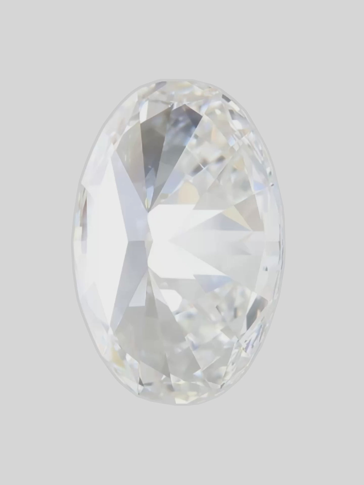 Load video: Rotating video of a colorless oval cut lab-grown diamond showing its sparkle — Bow Tie Lab Diamonds