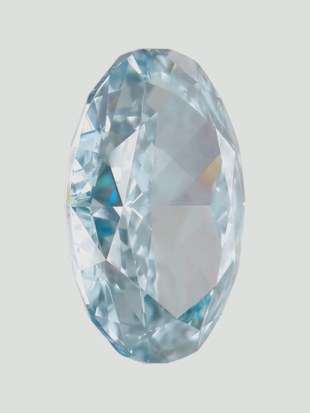 Load video: Rotating video of a fancy blue oval cut lab-grown diamond showing its sparkle — Bow Tie Lab Diamonds