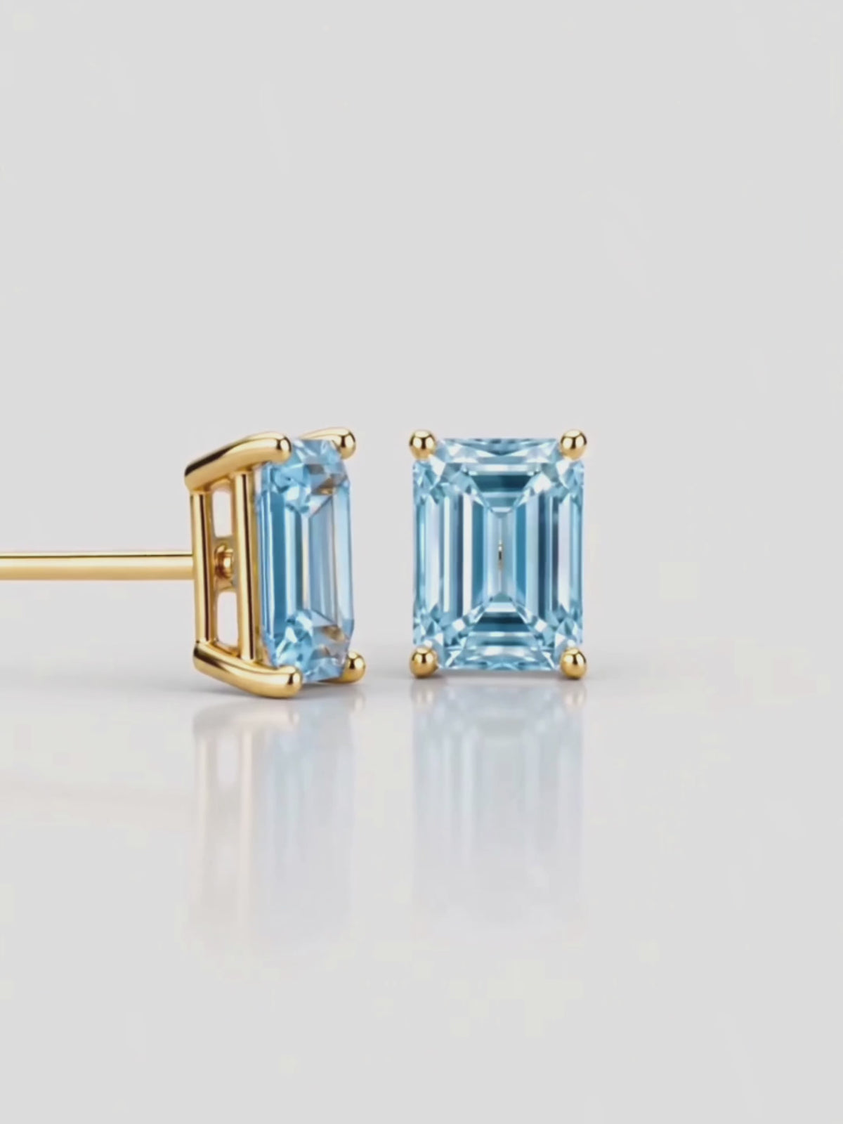Load video: Video of the Fancy Blue Emerald Cut Lab-Grown Diamond Stud Earrings, showing sparkle and movement — Bow Tie Lab Diamonds
