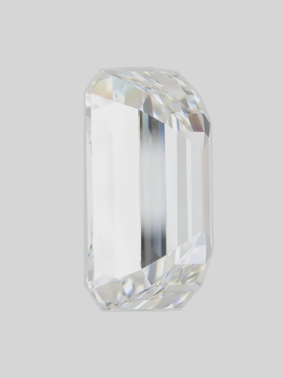 Load video: Rotating video of a colorless emerald cut lab-grown diamond showing its sparkle — Bow Tie Lab Diamonds