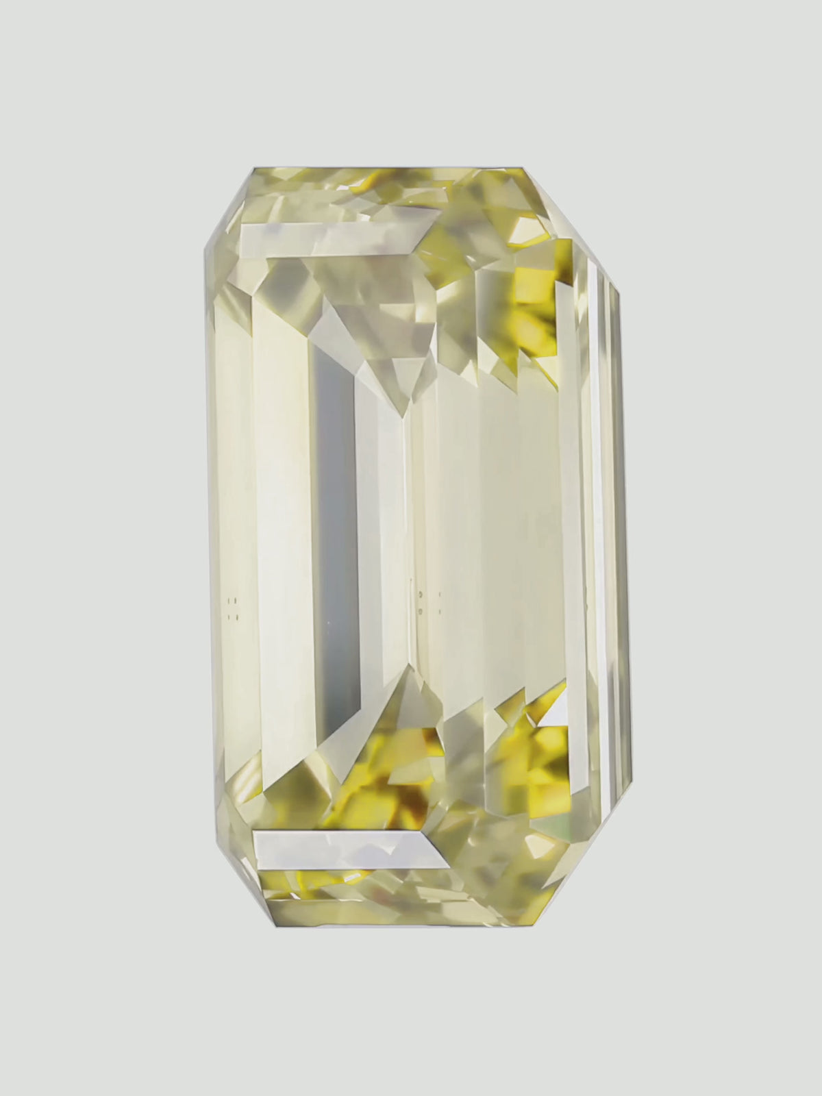 Load video: Rotating video of a fancy yellow emerald cut lab-grown diamond showing its sparkle — Bow Tie Lab Diamonds